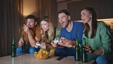 gaming group enjoy video play at evening home. excited people competing together