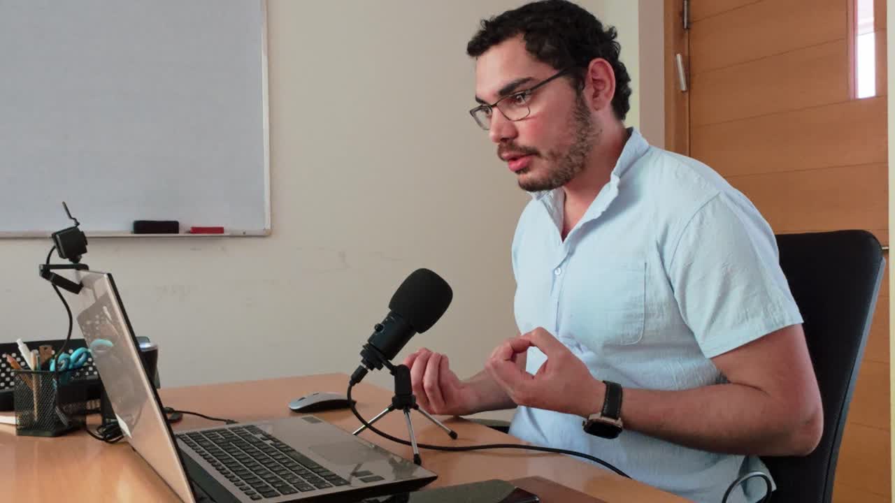 Person giving a presentation or interview on a laptop