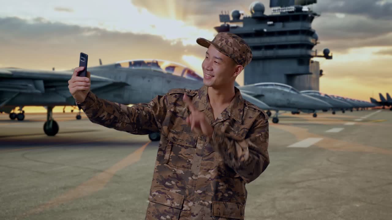 Military Personnel Taking a Selfie on an Aircraft Carrier