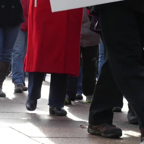 anti-trump protestors march no faces