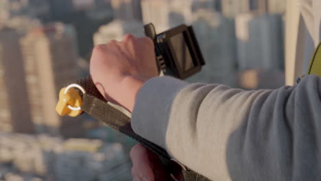 the pilot of a helicopter operates the buttons drive passes over the city of rio de janeiro, brazil