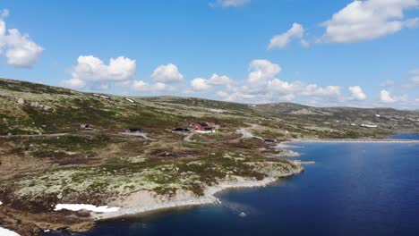 Dronefootage--of-cabin-in-norwegian-mountainlandscape