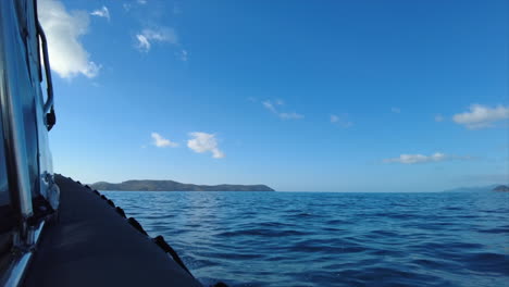shot from a boat heading towards the whitsunday islands, qld, australia