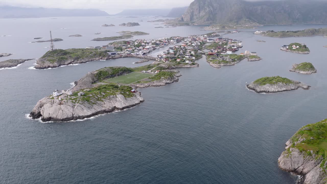 Drone shot of Henningsvaer soccer field in Lofoten Islands in Norway during summer 4k