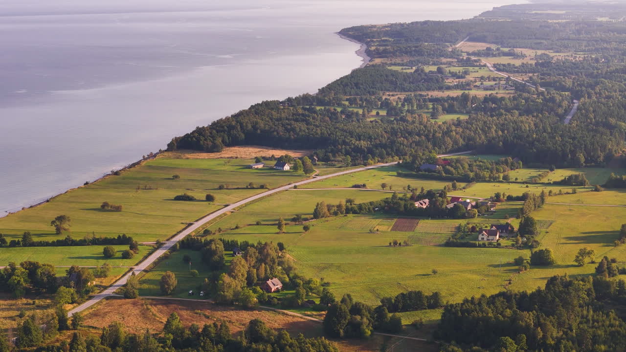 Aerial Flyover Large Development Land (Empty Farmland) In Strante, Saka Parish, Latvia.