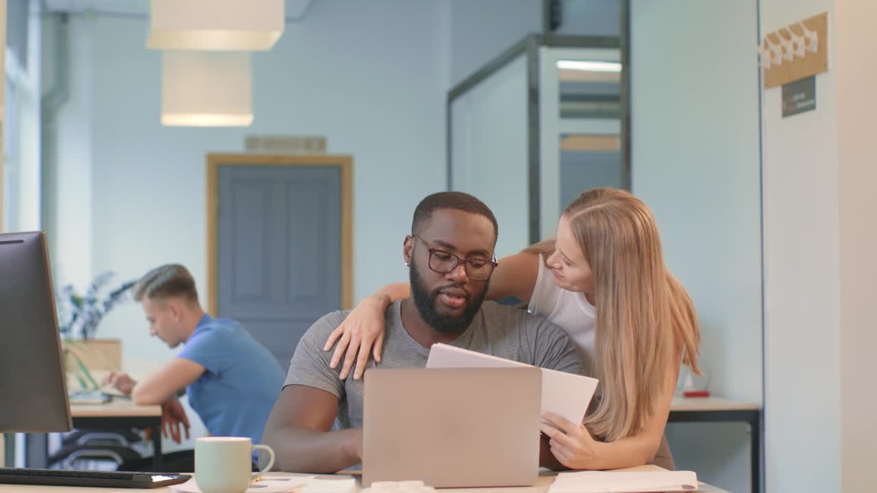 Business woman coming to get results at coworking. Young woman flirting with man