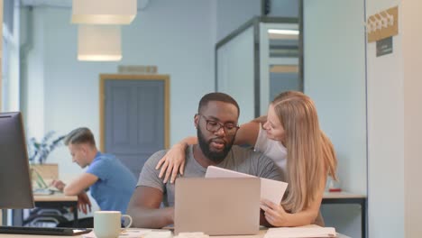 business woman coming to get results at coworking. young woman flirting with man