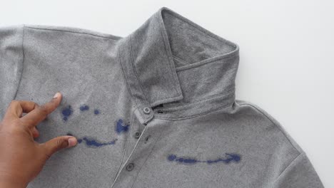 removing a blue stain from a gray polo shirt