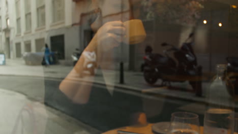 woman enjoying breakfast at a cafe