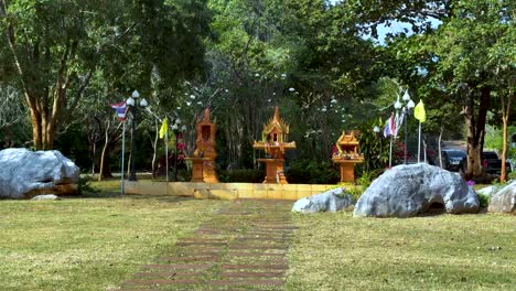 thai shrines in a garden setting