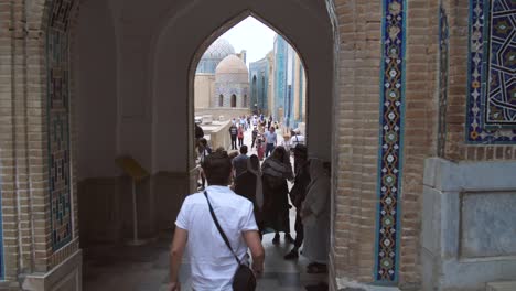 tourists under samarkand archway