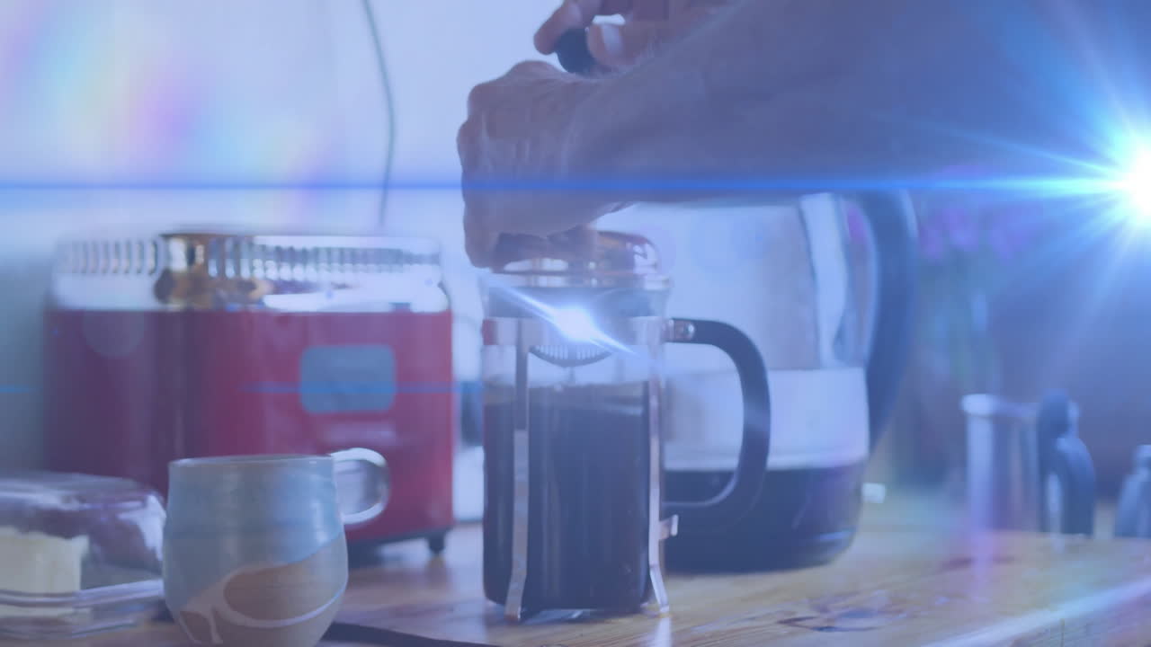 Man pressing French press plunger on wooden countertop, showing floating coffee sales charts