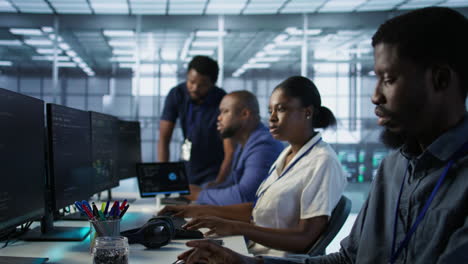 diverse it team working in a server room