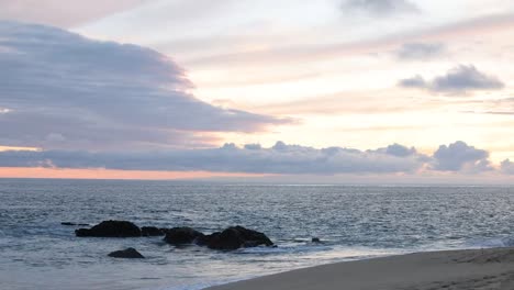 a sunset by the water in cabo, mexico