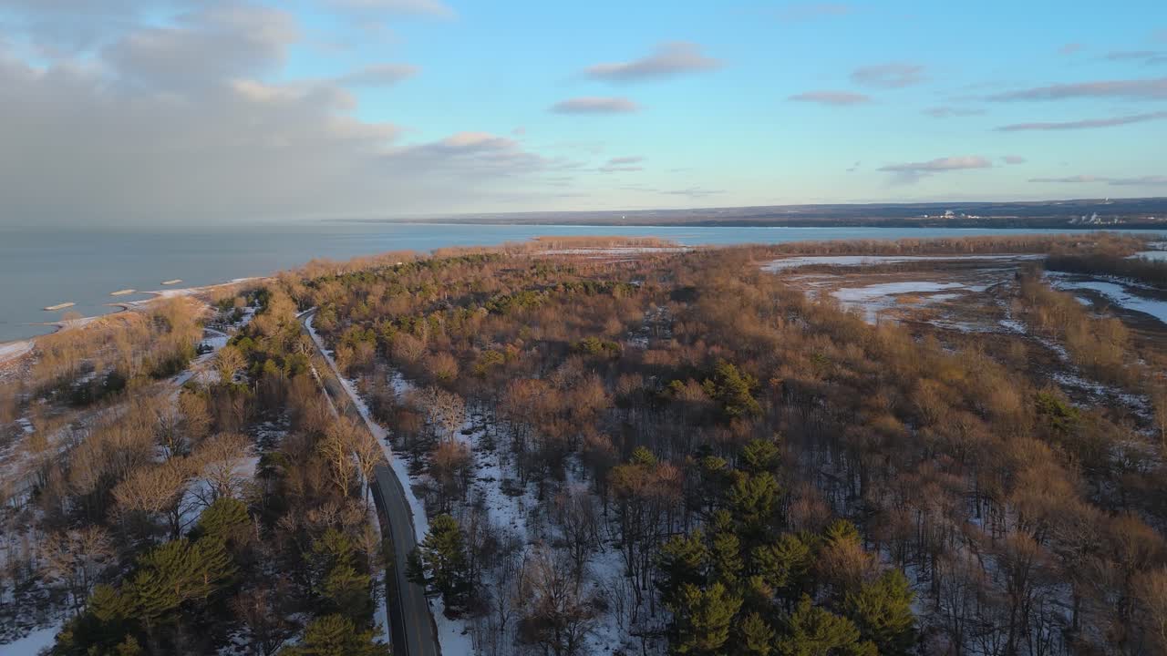 Aerial shot of Presque Isle at golden hour in the winter