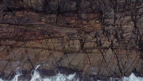 Rugged-Cliffs-And-Ocean-Waves-In-Arteixo,-Spain---aerial-top-down