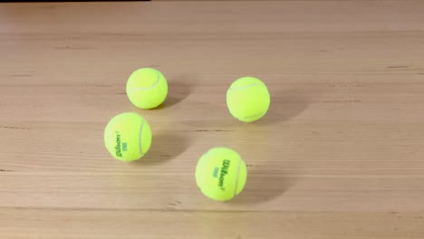 sequence of tennis balls bouncing and scattering