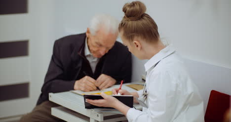 senior man at the doctor at health clinic