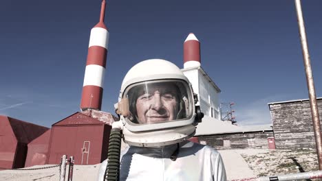 cosmonaut against rocket shaped antennas