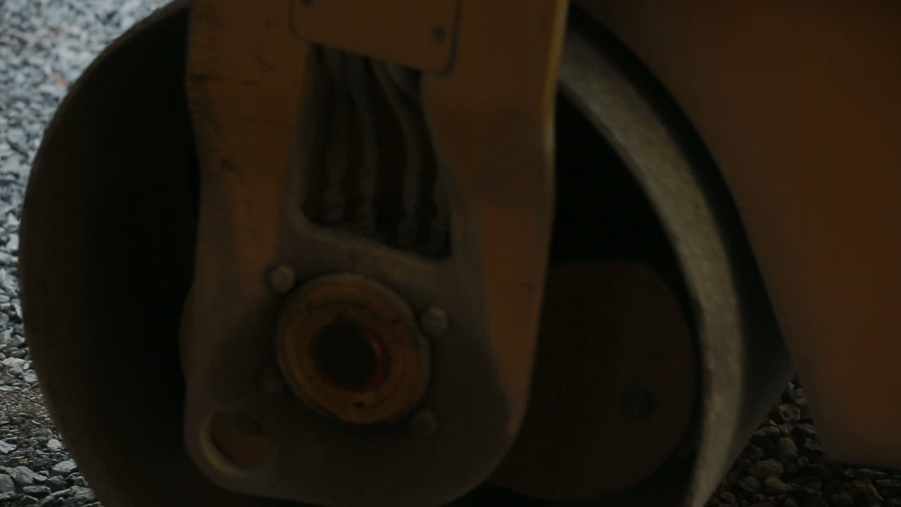 Road roller laying gravel during road construction