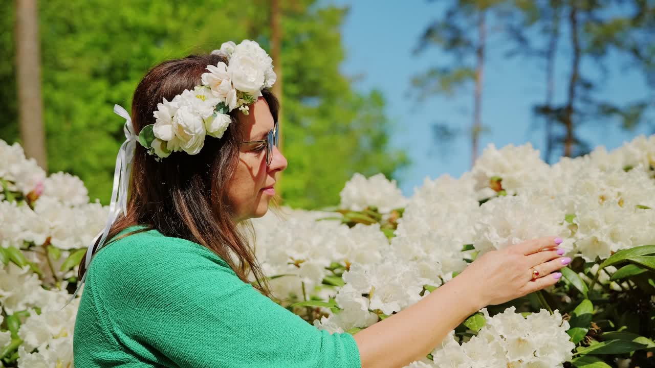 Emotional reflection of life changes amid white rhododendron blossoms Latvia