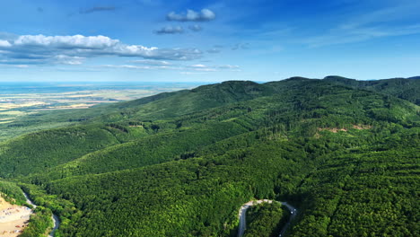 green landscape, blue sky. a sweeping view of verdant hills under a bright blue sky, showcasing the beauty of nature in a tranquil setting