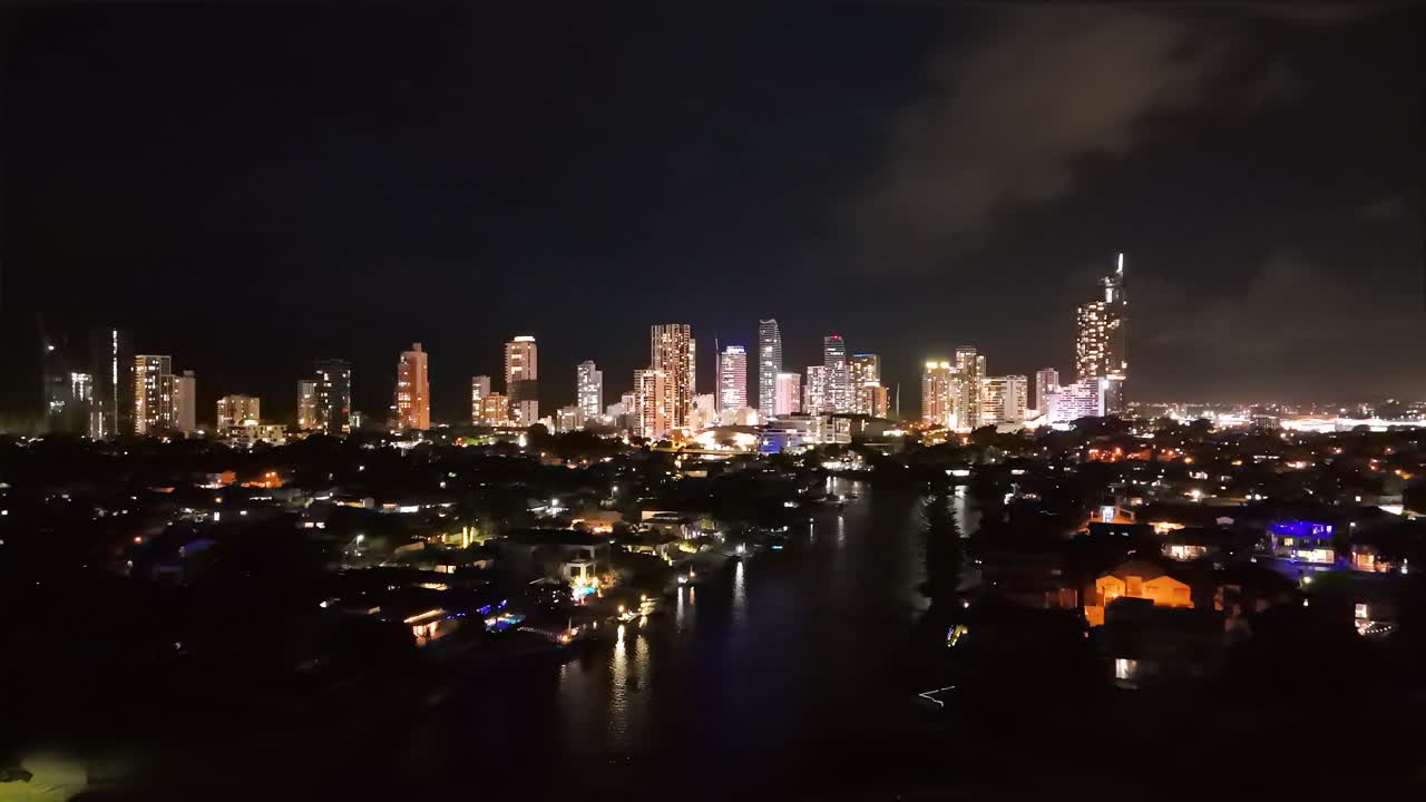 Vibrant city lights reflecting on water