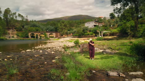 girl by the river in a summer day