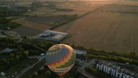 hot air balloon sunrise over rural landscape