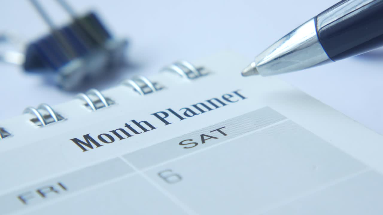 Close-up of a Month Planner with Pen