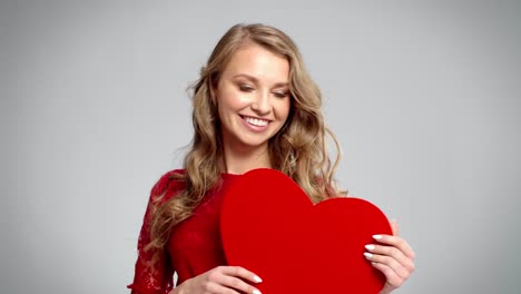 Beautiful-woman-holding-artificial-heart