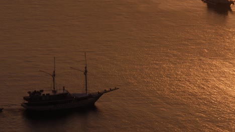 high-angle view of boats on the sea's surface in komodo national park, indonesia