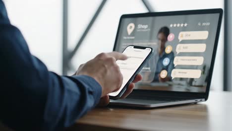 person engaging in a multi-device online shopping experience with phone and laptop