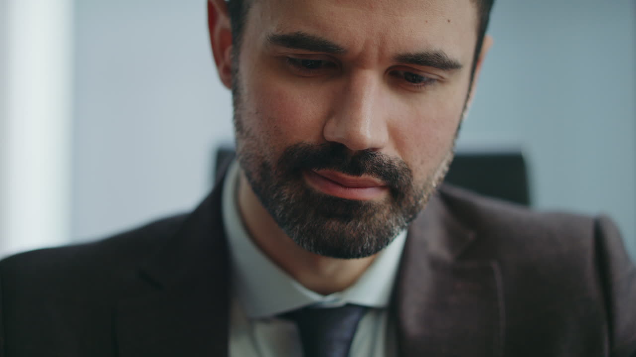 Handsome boss typing sms on smartphone at office close up. Businessman messaging