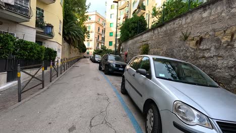 cars parked along a narrow alleyway