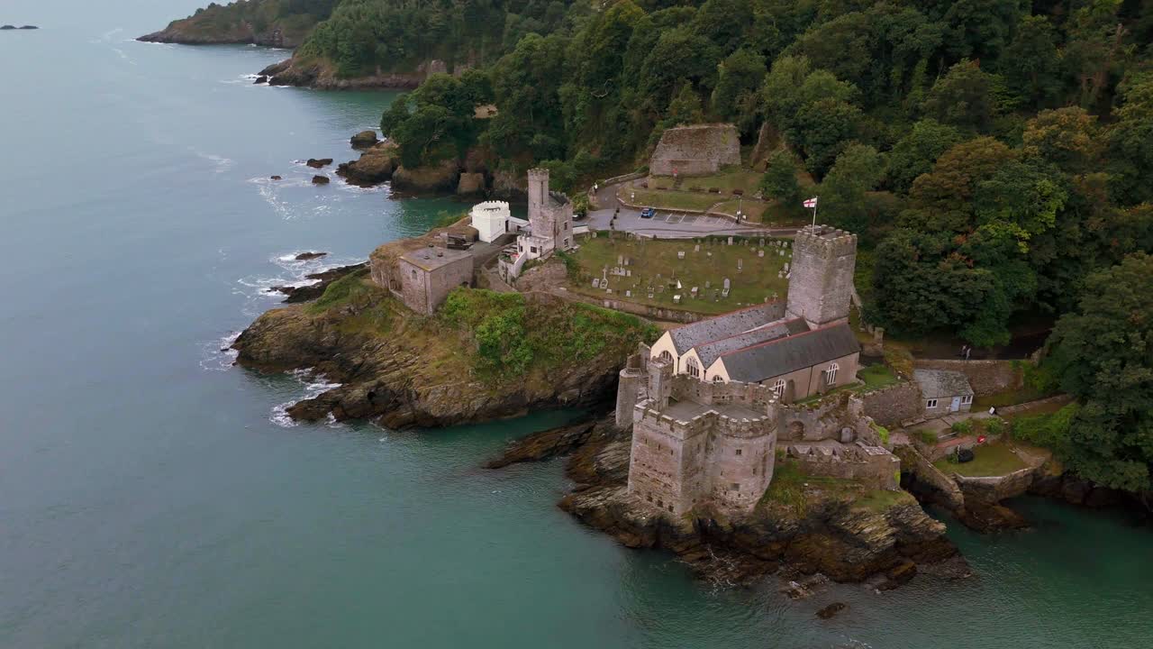 Daytime, aerial orbit around to rear of Dartmouth Castle looking back out to sea