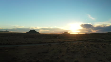 off-road adventure in an all-terrain vehicle in the mojave desert at sunset - aerial view