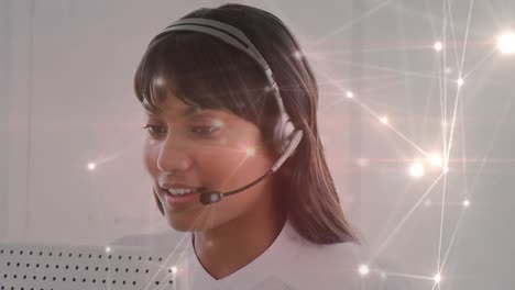 Animation-of-networks-of-connections-over-businesswoman-using-phone-headsets