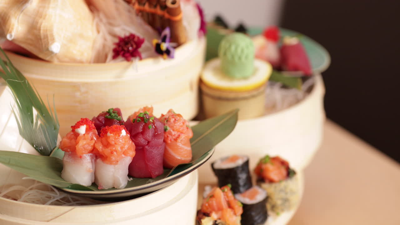A Variety Of Sushi Rolls And Sashimi In Plates Rotating On The Table In A Japanese Restaurant - extreme close up