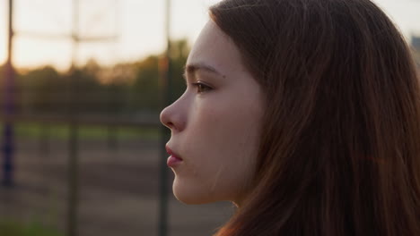 distressed woman looks into distance closeup. young woman reflects on mistakes of past blaming herself for last events. profound sense of loneliness