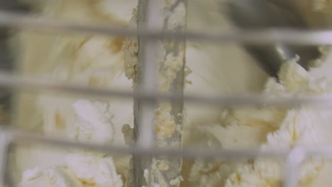 Close-up-of-butter-and-icing-being-mixed-up-to-create-a-topping-for-cakes