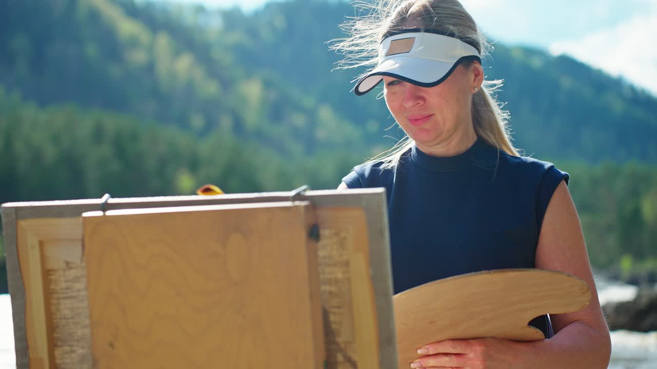 Woman Painting Outdoors in Nature