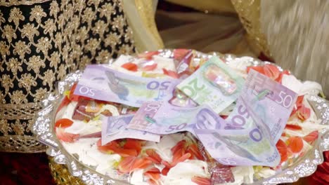 shot of new zealand cash used as dowry in a wedding