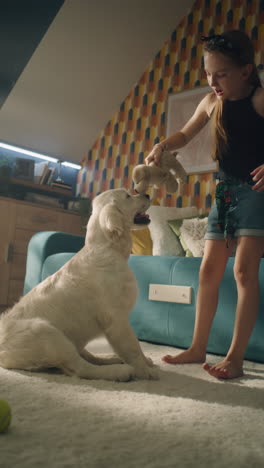 girl playing with dog