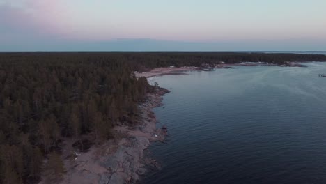 aerial view of finland's coast during sunset in faboda beach, pietarsaari, finland, aerial dolly shot