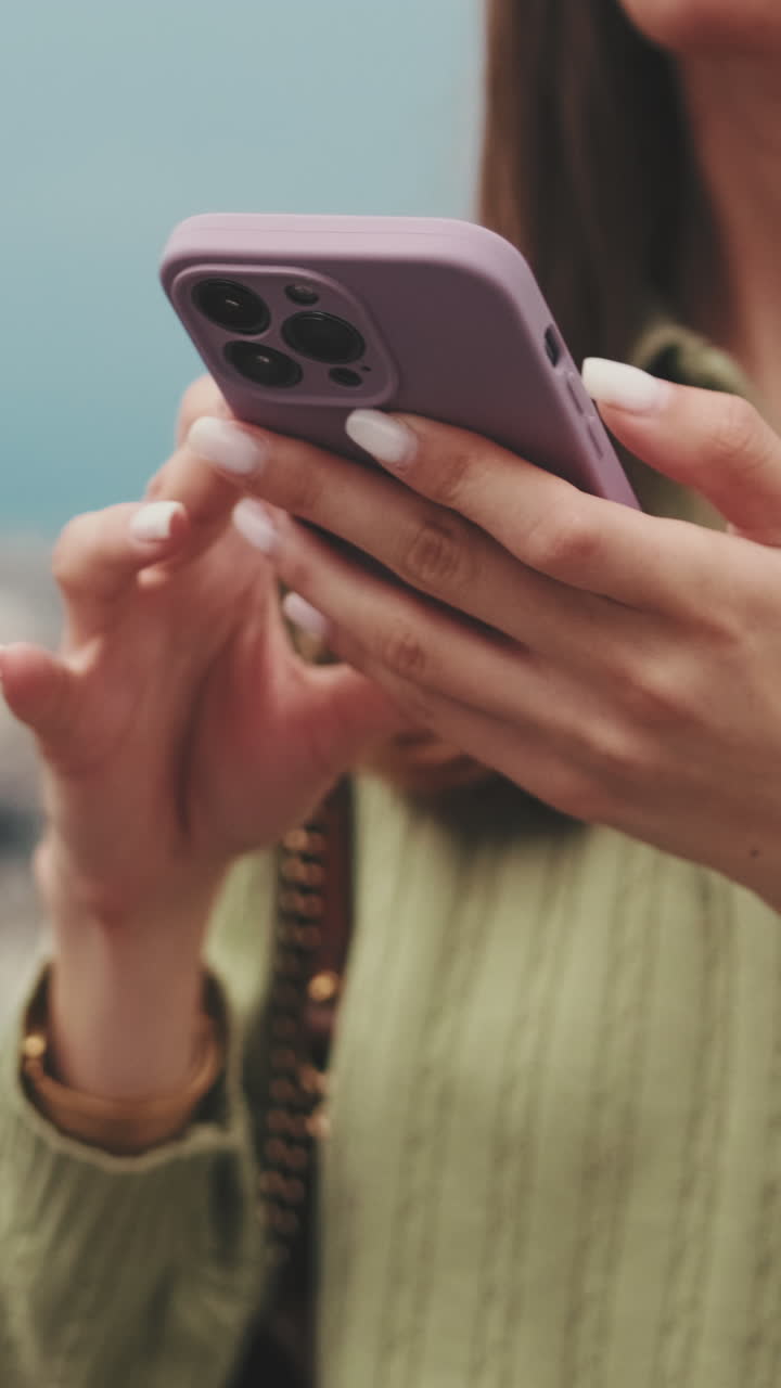 Close-up of Woman's Hands Tapping and Scrolling on a Smartphone