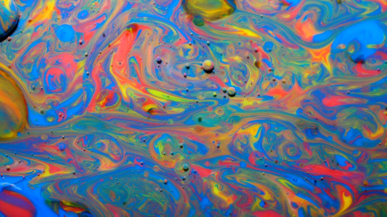 movimiento lento colores brillantes burbujas de aceite hermosa pintura color del universo moviéndose multicolor de cerca. pintura acrílica. fantástica superficie hipnótica. abstracto pintura de colores burbujas estructura de metamorfosis