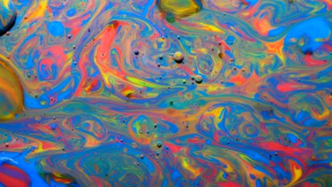 movimiento lento colores brillantes burbujas de aceite hermosa pintura color del universo moviéndose multicolor de cerca. pintura acrílica. fantástica superficie hipnótica. abstracto pintura de colores burbujas estructura de metamorfosis