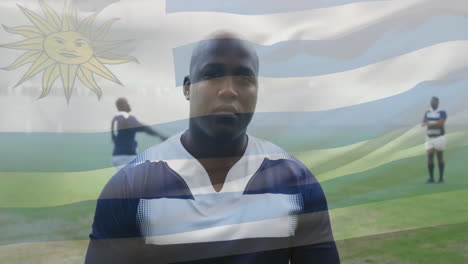 animation of flag of uruguay over diverse rugby players on field