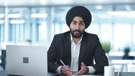 happy sikh indian businessman talking to employees